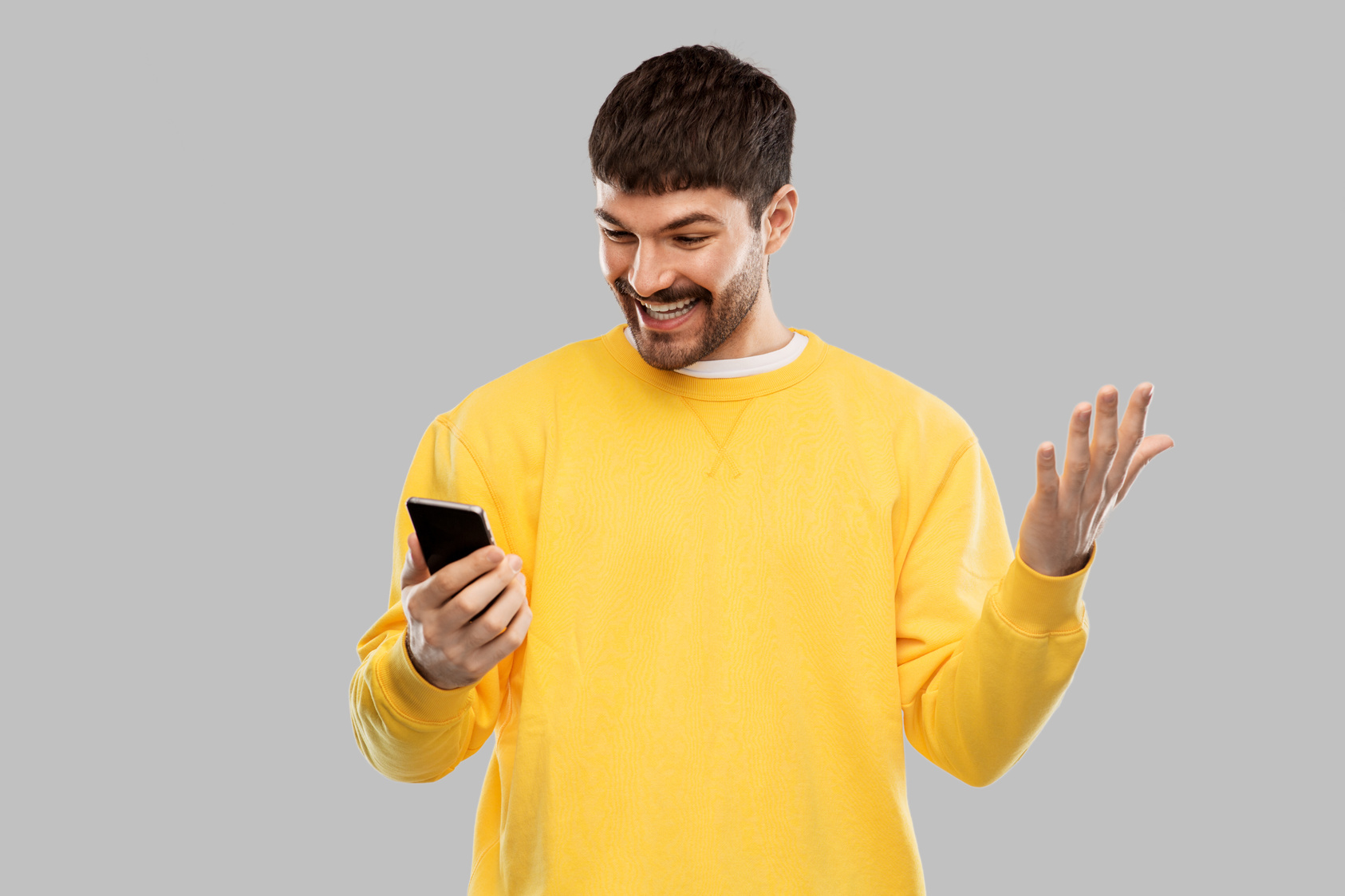 Happy Smiling Young Man with Smartphone